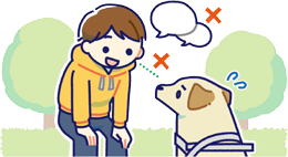 仕事中のほじょ犬に目をあわせて話しかけている人のイラスト